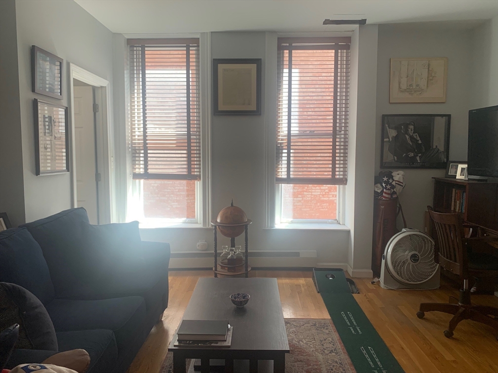 483 Beacon Street, Unit 26 Boston, MA 02115 - Photo 4 of 9 a room with furniture and a window