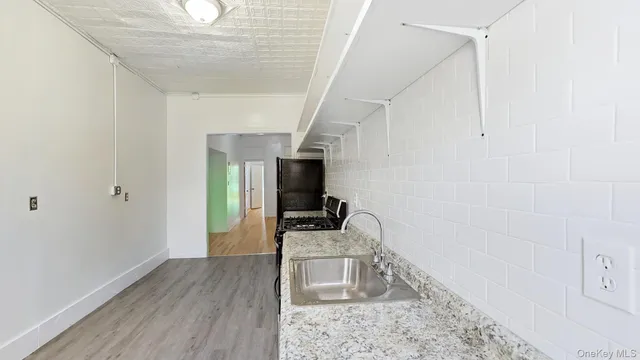 a bathroom with a sink and mirror