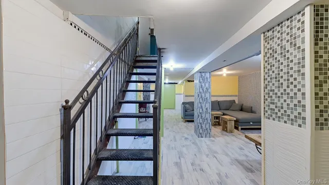 a view of a livingroom with furniture and a window