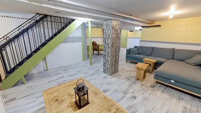 a living room with furniture and a rug