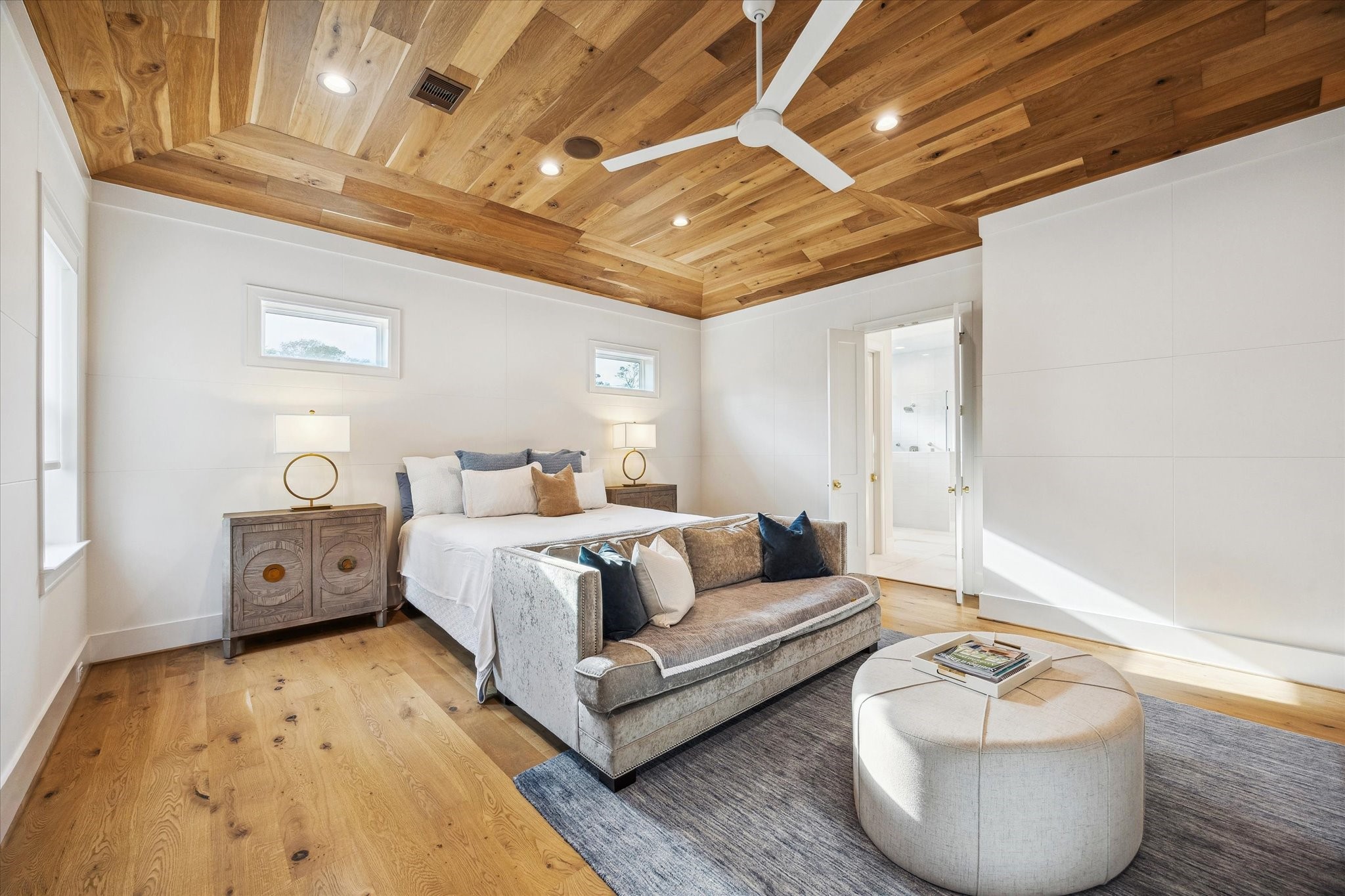 739 Azaleadell Drive Houston, TX 77018 - Photo 32 of 49 a spacious bedroom with a bed and a couch