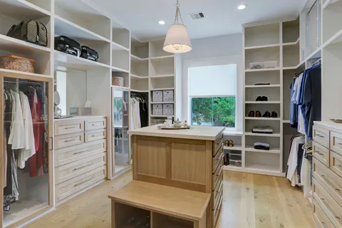 a bedroom with a bed and a table