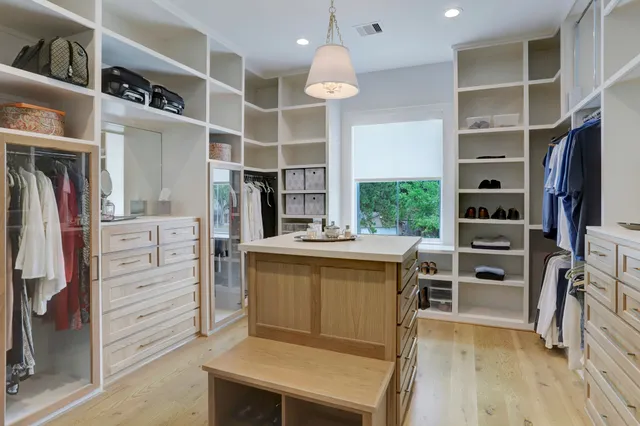 a bedroom with a bed and a table