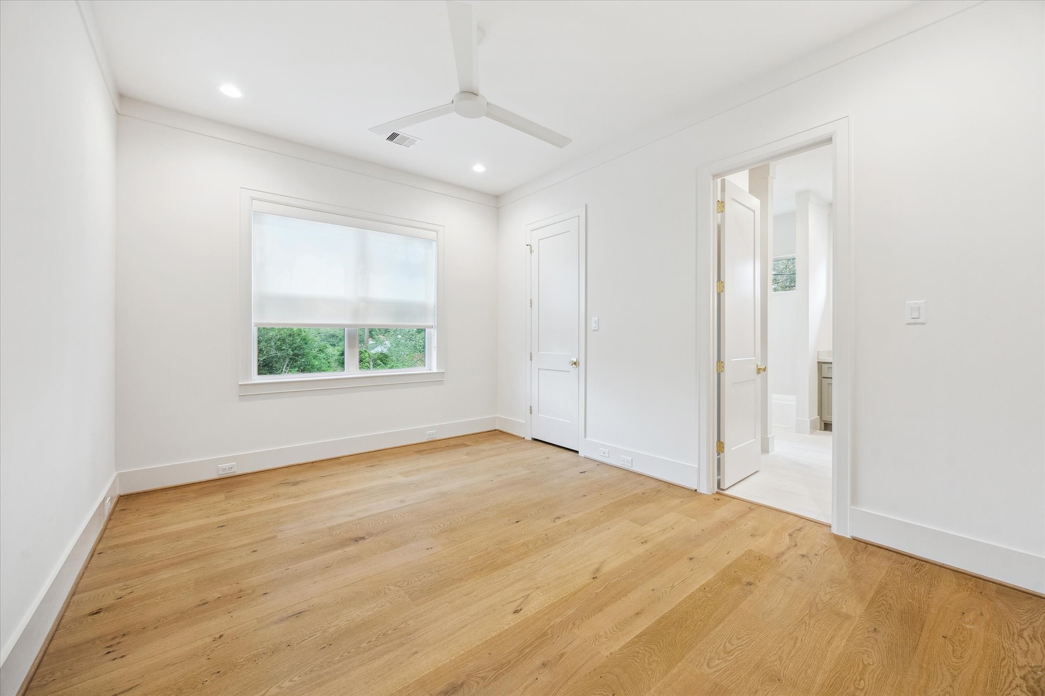 739 Azaleadell Drive Houston, TX 77018 - Photo 39 of 49 a view of an empty room with wooden floor and a window