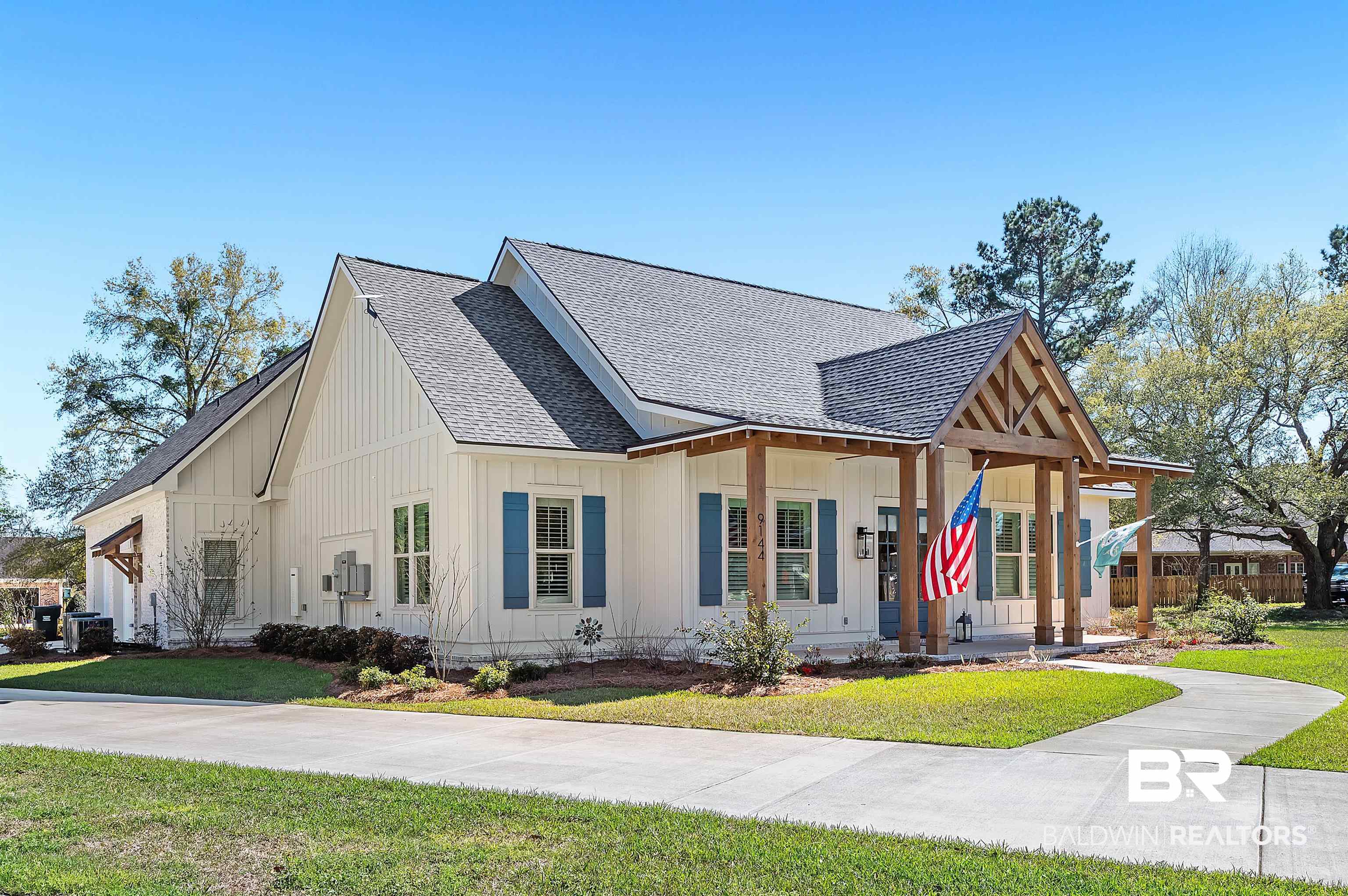 9144 Harvest Ridge Fairhope, AL 36532 - Photo 3 of 58 Modern farmhouse style home with roof with shingles, board and batten siding, and a front yard