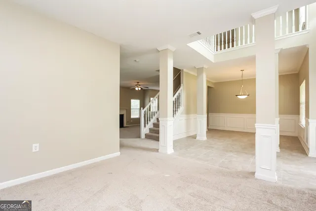 a view of a hallway with a bathroom