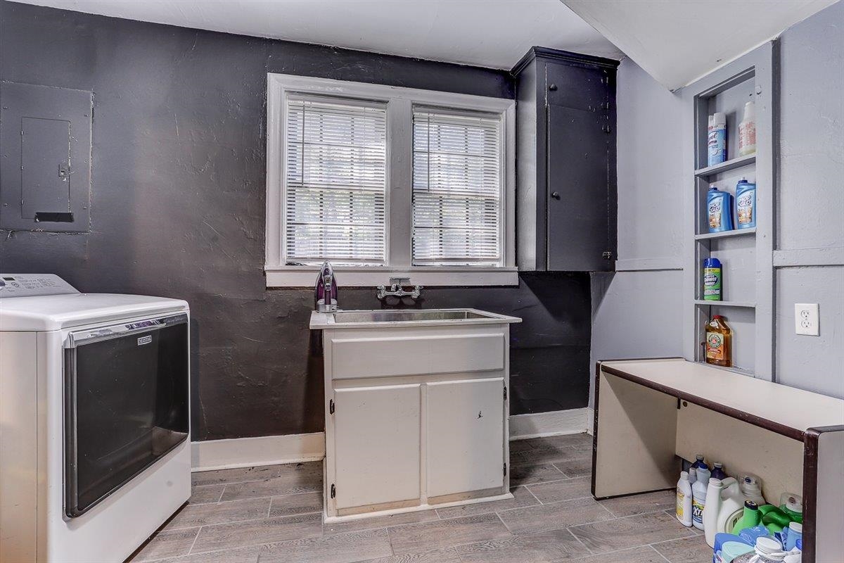 3700 Lakeview Road Memphis, TN 38116 - Photo 18 of 40 Laundry area featuring washer / dryer, electric panel, and wood finish floors