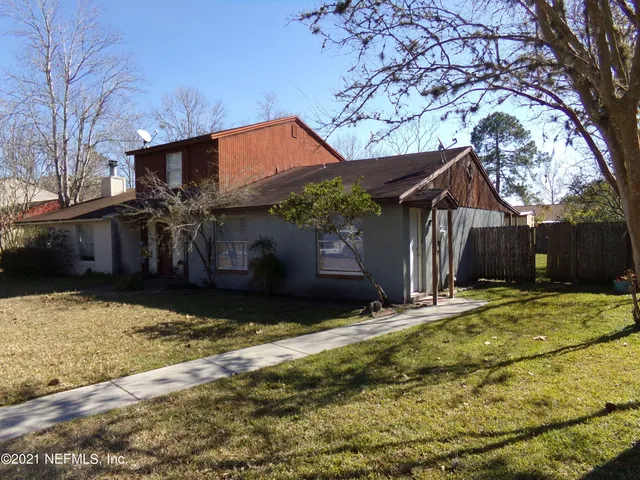a house with trees in front of it