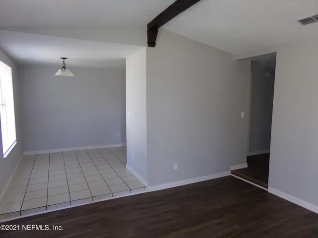 a kitchen with a stove sink and refrigerator