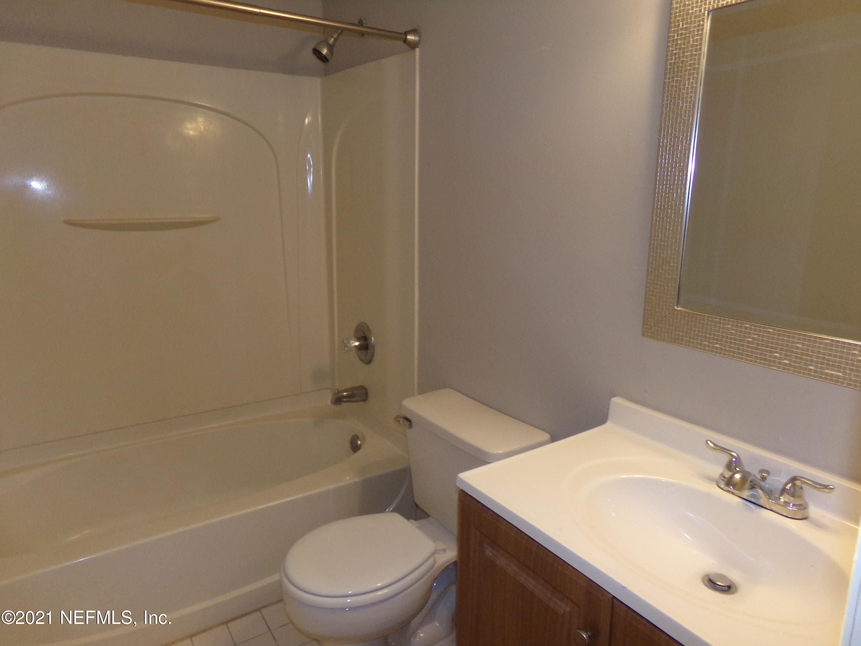 2652 Sunrise Village Drive, Unit C Orange Park, FL 32065 - Photo 7 of 7 a bathroom with a sink toilet and shower