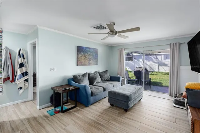 a living room with furniture flat screen tv and a fireplace