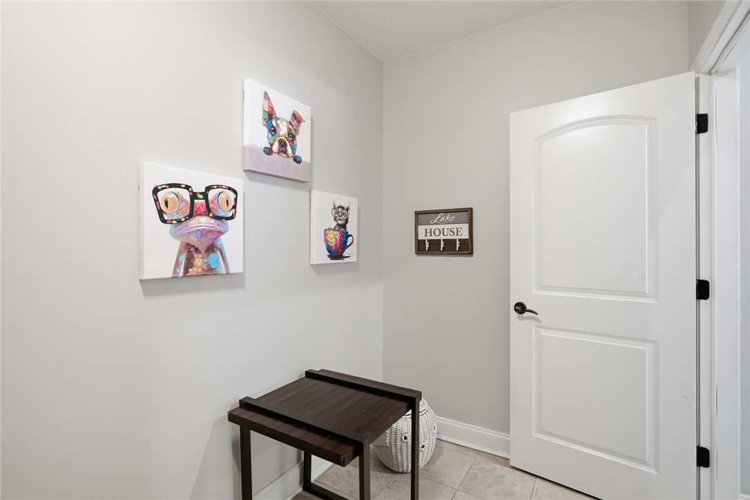 578 Sunset Point Drive West Union, SC 29696 - Photo 26 of 46 This bright entry offers a welcoming atmosphere, featuring practical tiled flooring and an elegant arched door.
