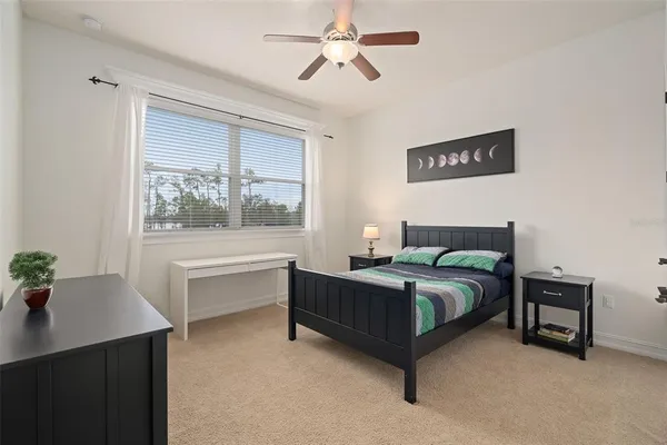 a view of a livingroom with furniture and a flat screen tv