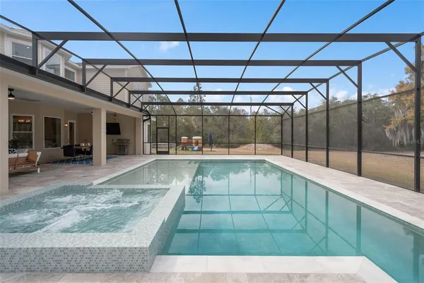 an aerial view of residential houses with city view