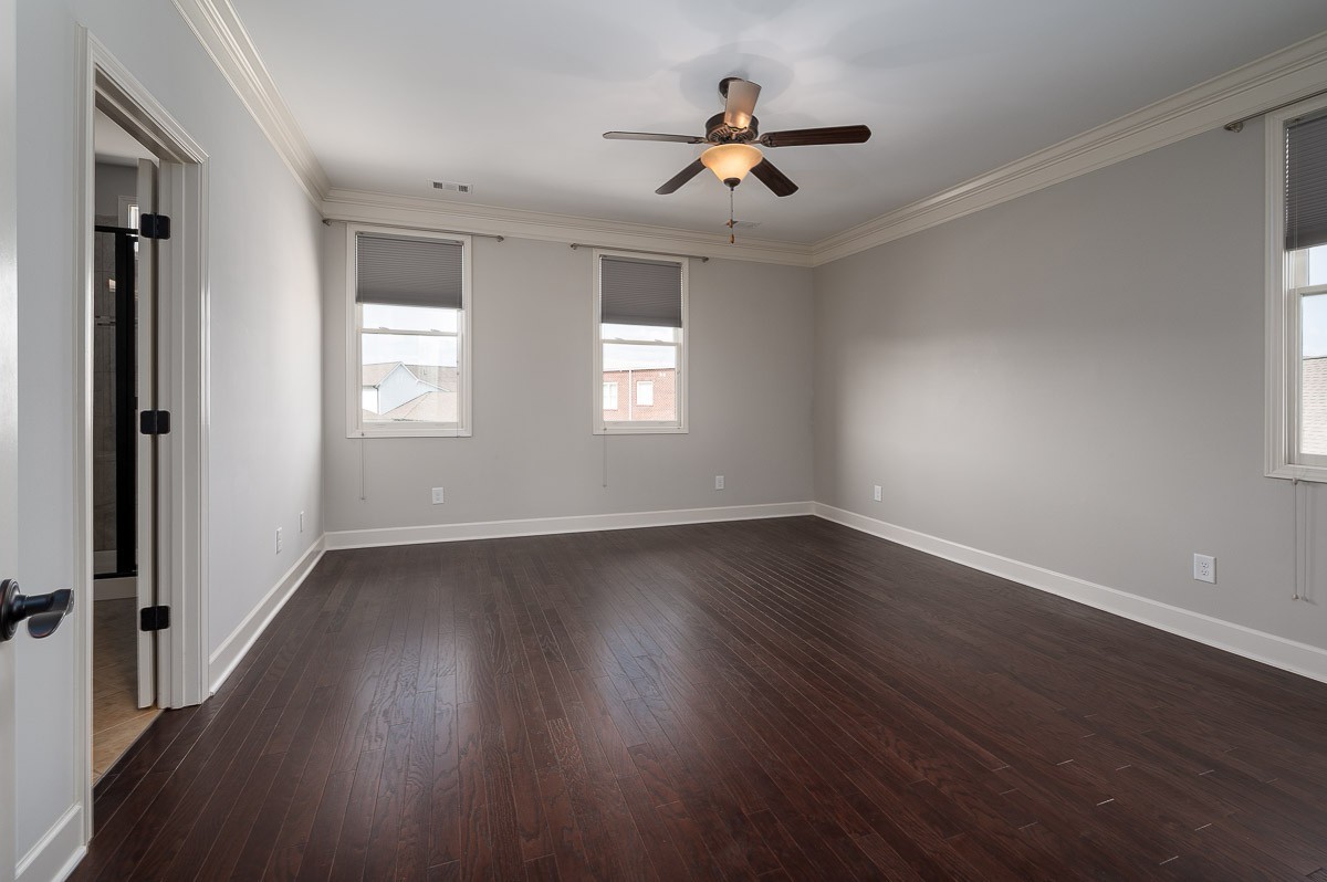 2069 Rural Plains Circle Franklin, TN 37064 - Photo 19 of 34 an empty room with wooden floor and windows