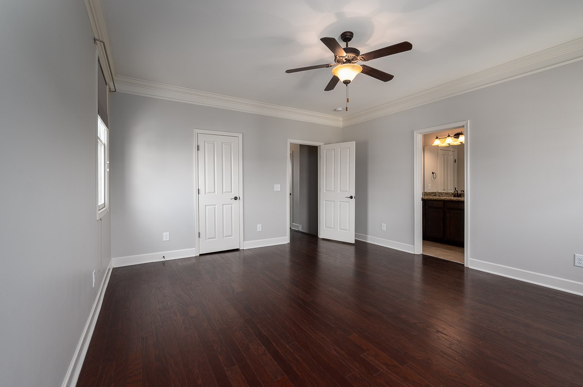 2069 Rural Plains Circle Franklin, TN 37064 - Photo 20 of 34 an empty room with wooden floor ceiling fan and windows