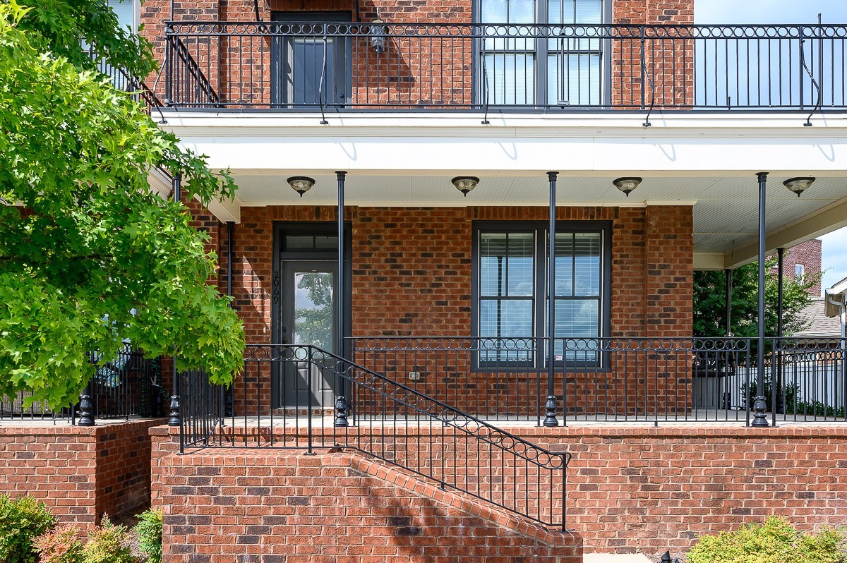 2069 Rural Plains Circle Franklin, TN 37064 - Photo 2 of 34 a front view of a building with a glass door