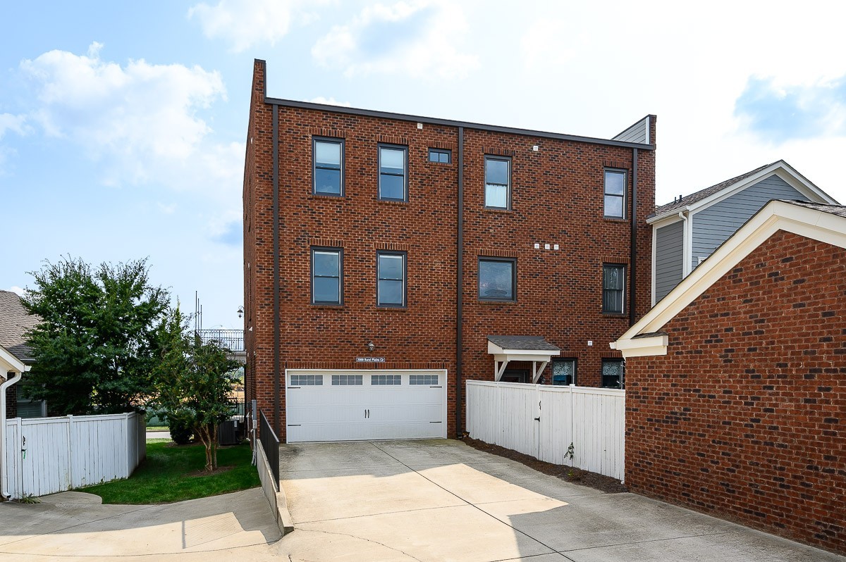 2069 Rural Plains Circle Franklin, TN 37064 - Photo 27 of 34 a front view of a house with a yard