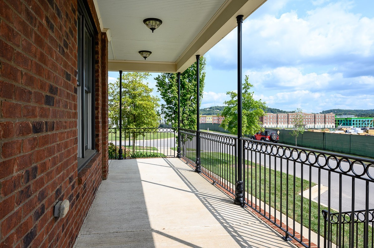 2069 Rural Plains Circle Franklin, TN 37064 - Photo 3 of 34 a view of a balcony with wooden floor