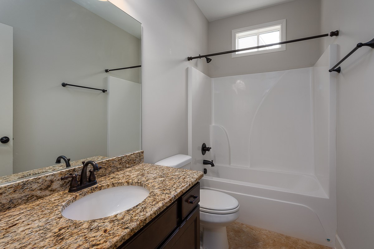 2069 Rural Plains Circle Franklin, TN 37064 - Photo 7 of 34 a bathroom with a granite countertop sink toilet and shower