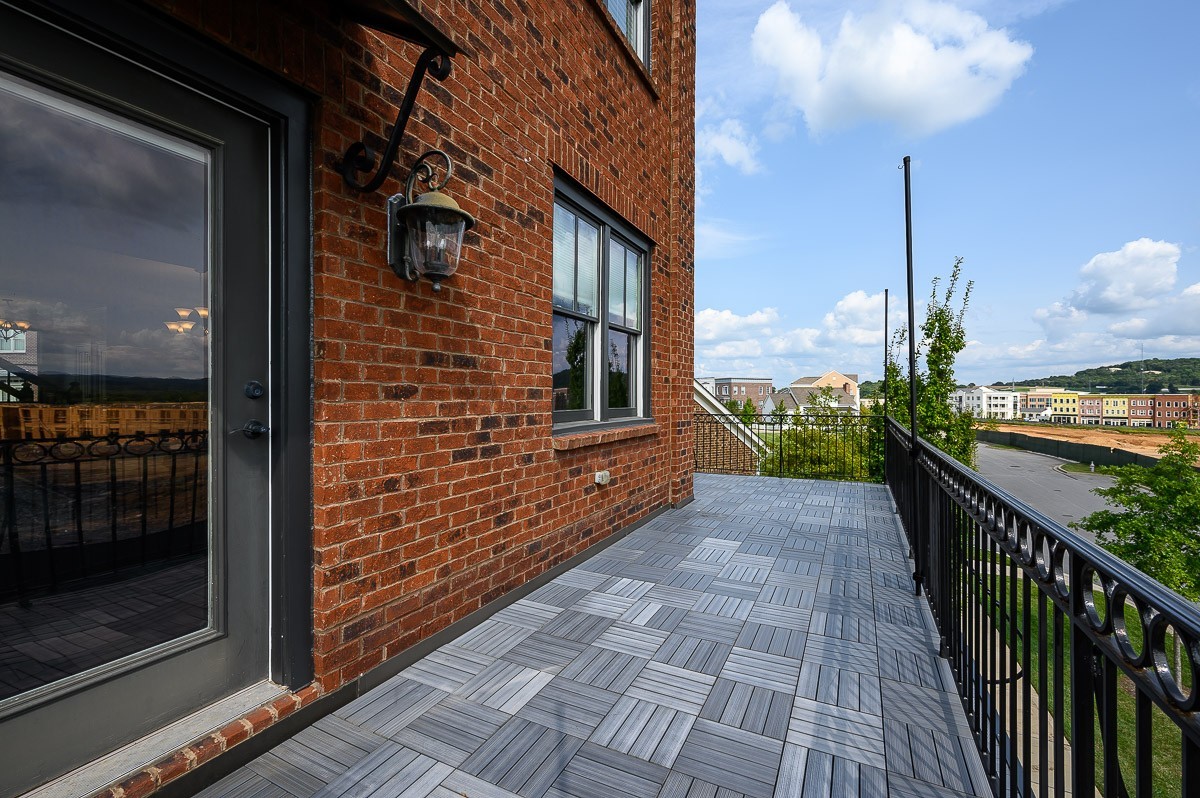 2069 Rural Plains Circle Franklin, TN 37064 - Photo 9 of 34 a view of a balcony both side of a house