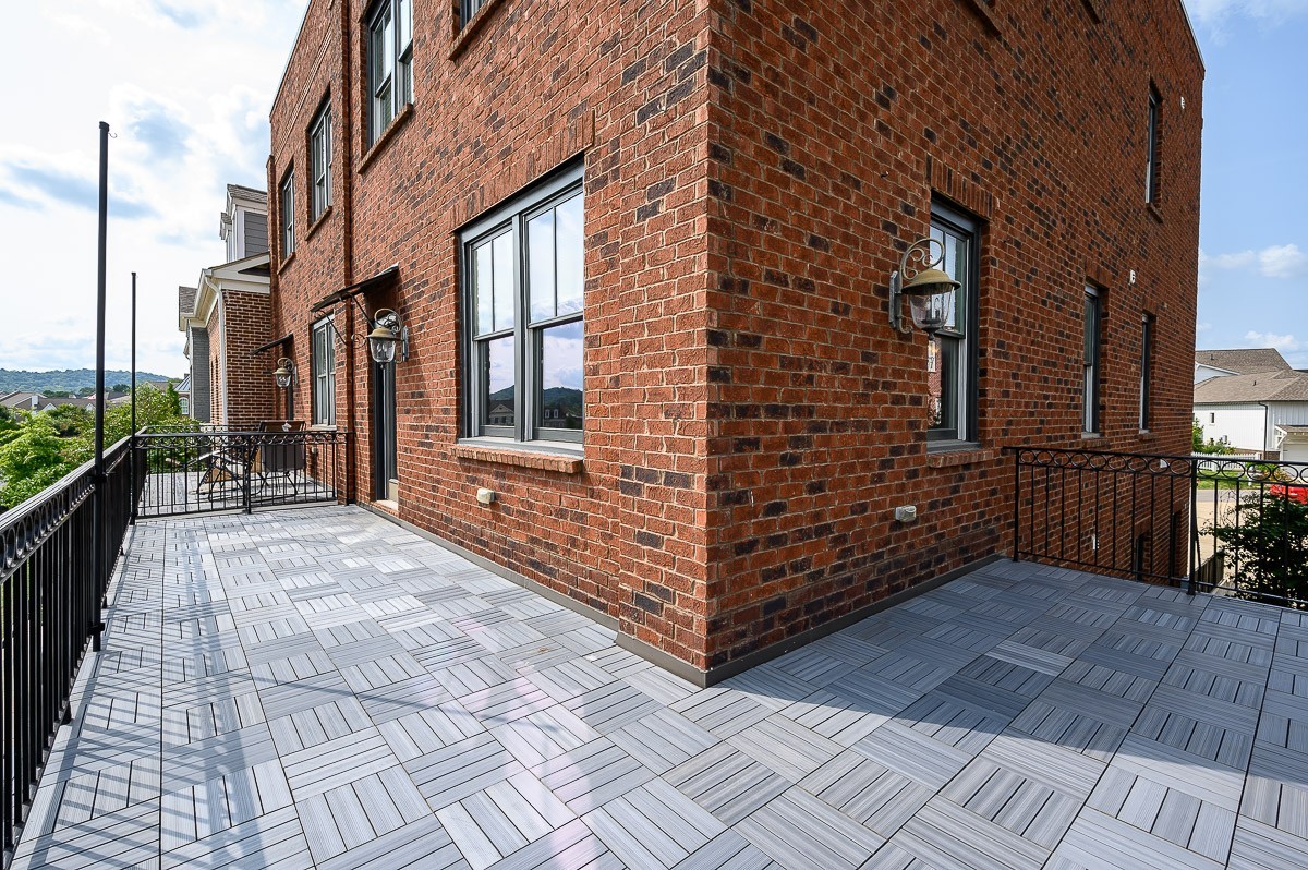 2069 Rural Plains Circle Franklin, TN 37064 - Photo 10 of 34 a view of a brick buildings with many windows