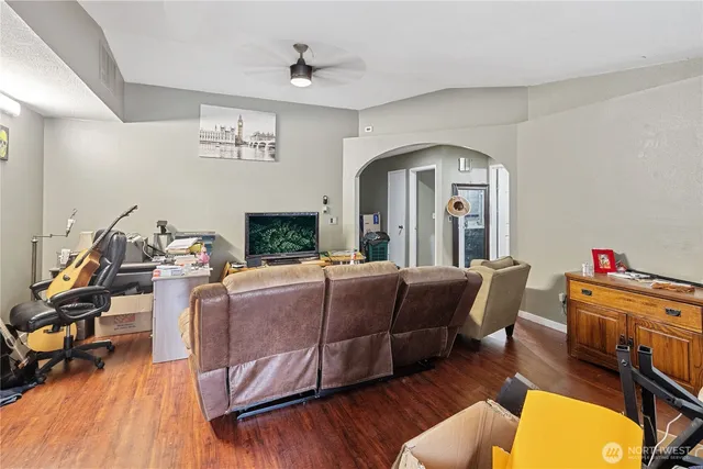 a living room with furniture and a large window