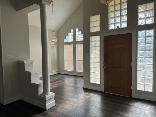 a view of an entryway with wooden floor