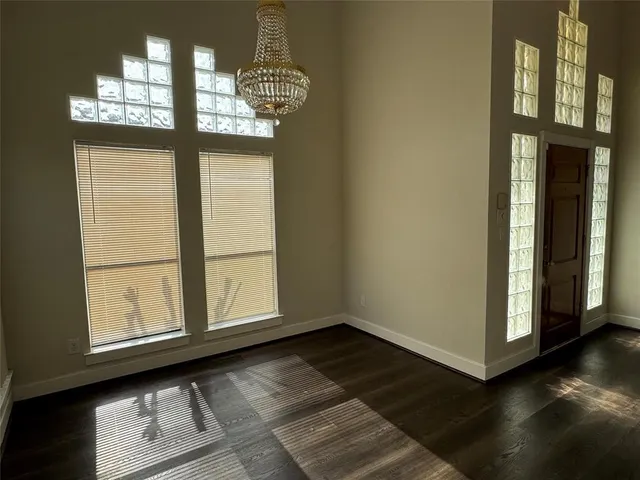a view of an entryway with wooden floor