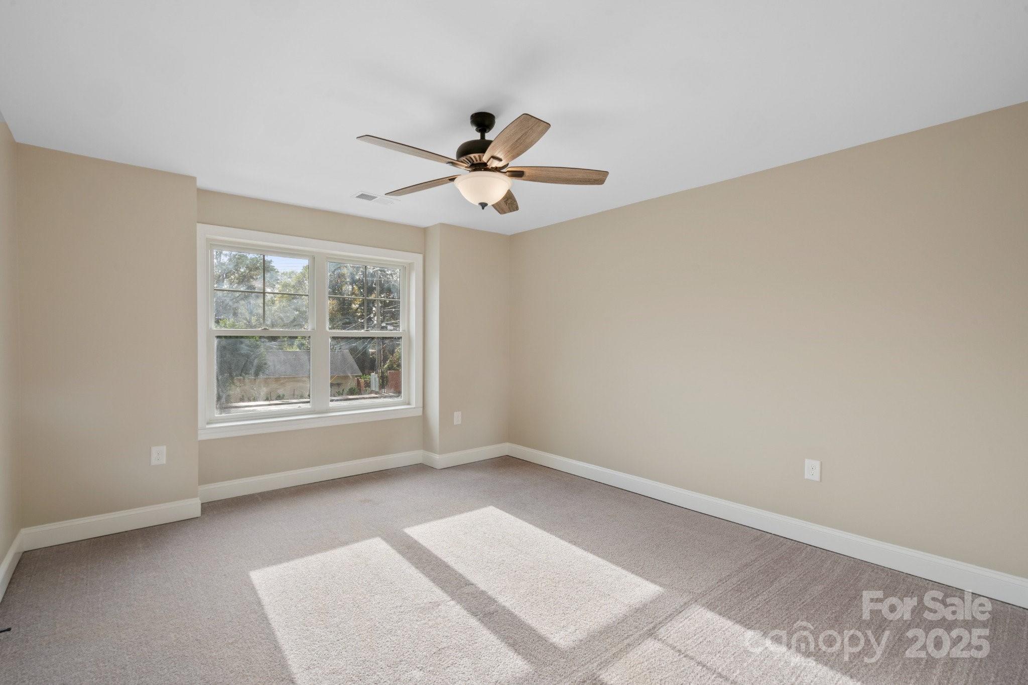 4023 Randolph Road Charlotte, NC 28211 - Photo 30 of 48 a view of room with a ceiling fan and window