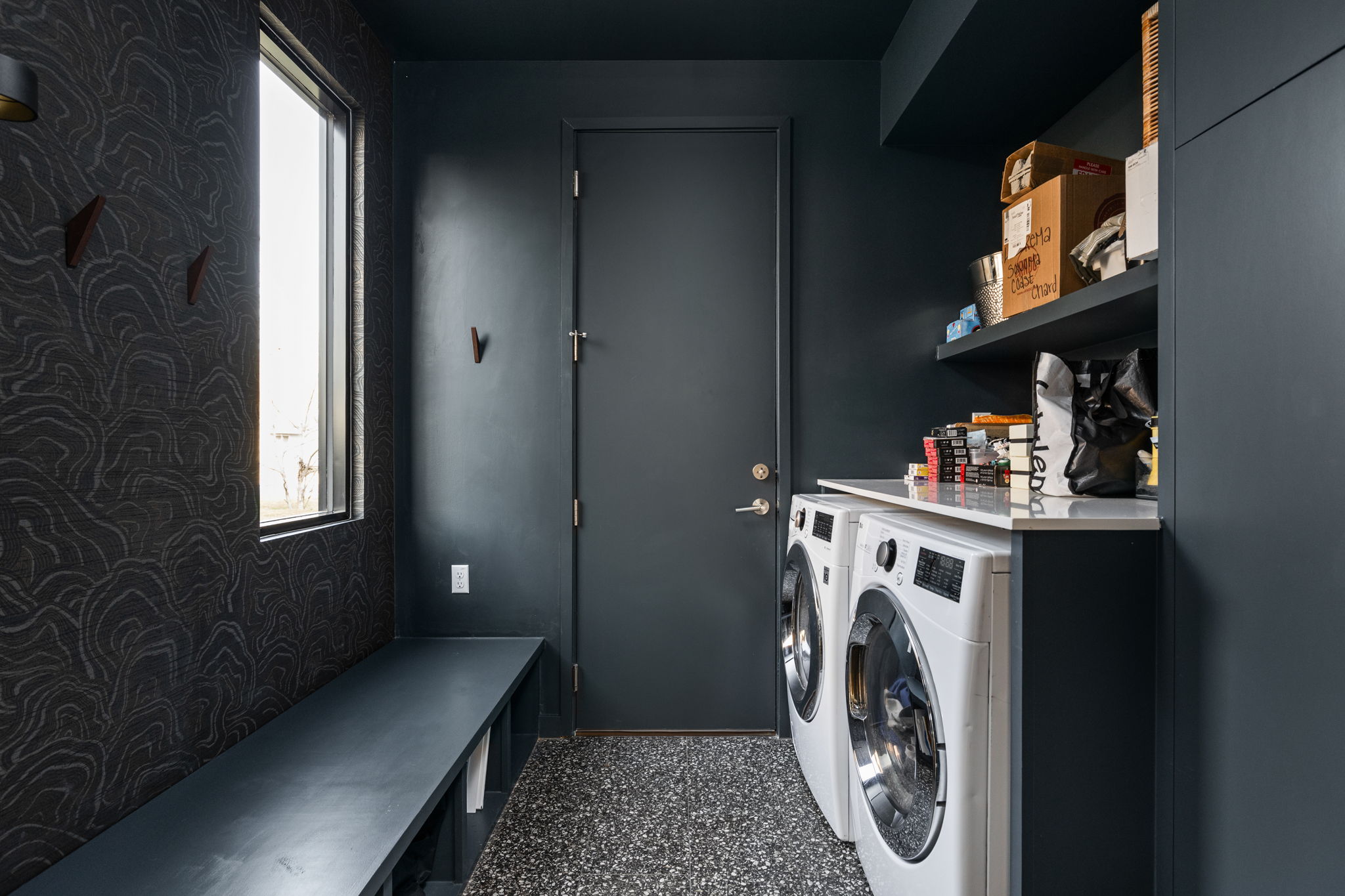 7502 St Louis Street Austin, TX 78757 - Photo 8 of 38 Laundry area with washer and clothes dryer and light speckled floor