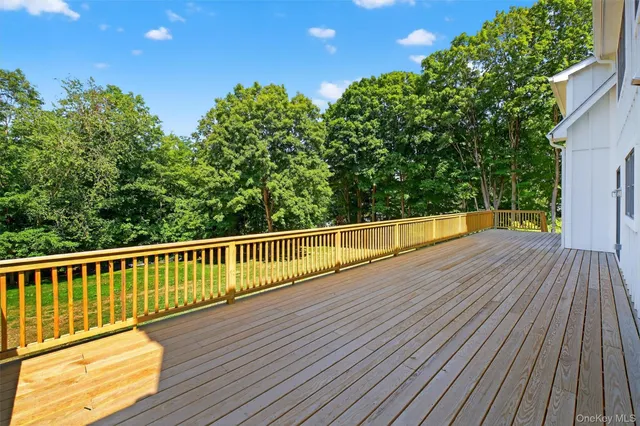a view of balcony with deck and wooden floor