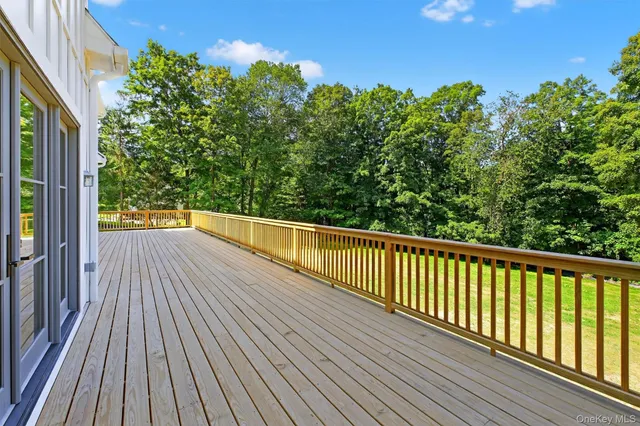 a view of balcony with wooden floor