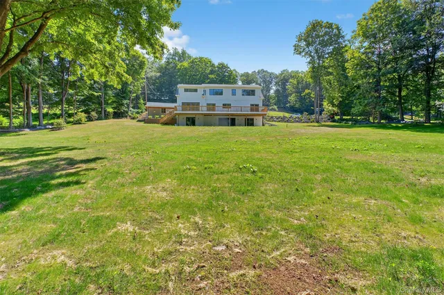 a view of a house with a big yard