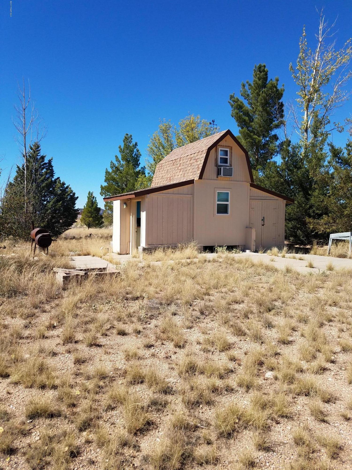 a view of a backyard of the house