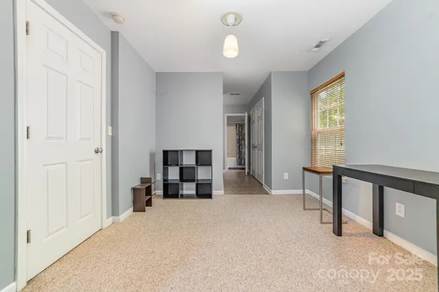 a view of a livingroom with furniture and windows