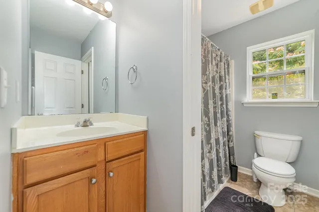 a bathroom with a sink toilet and vanity