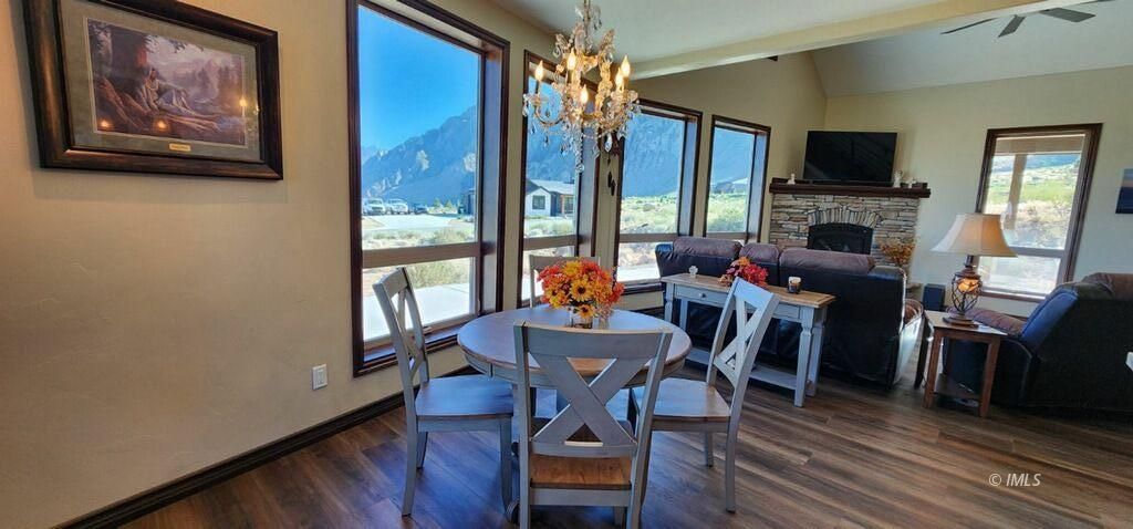 75 Ridgeview Bishop, CA 93514 - Photo 11 of 35 a view of a dining room with furniture window and wooden floor