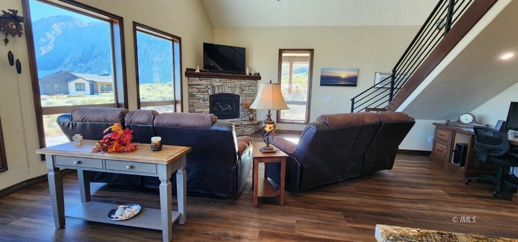 75 Ridgeview Bishop, CA 93514 - Photo 12 of 35 a living room with furniture a flat screen tv and a fireplace