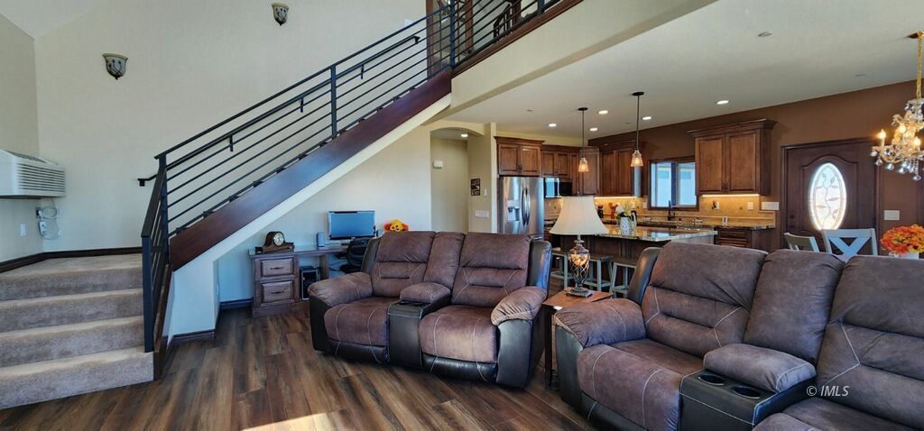 75 Ridgeview Bishop, CA 93514 - Photo 13 of 35 a living room with furniture and a wooden floor