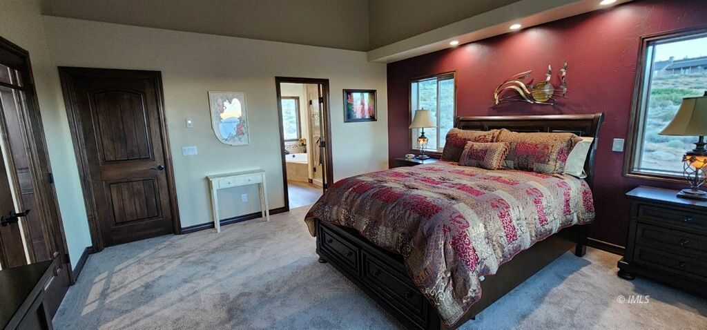 75 Ridgeview Bishop, CA 93514 - Photo 22 of 35 a bed room with a bed and a mirror