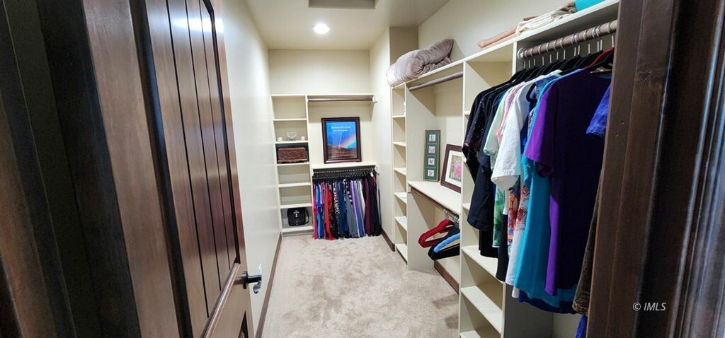 75 Ridgeview Bishop, CA 93514 - Photo 24 of 35 a view of walk in closet with clothes and shoes