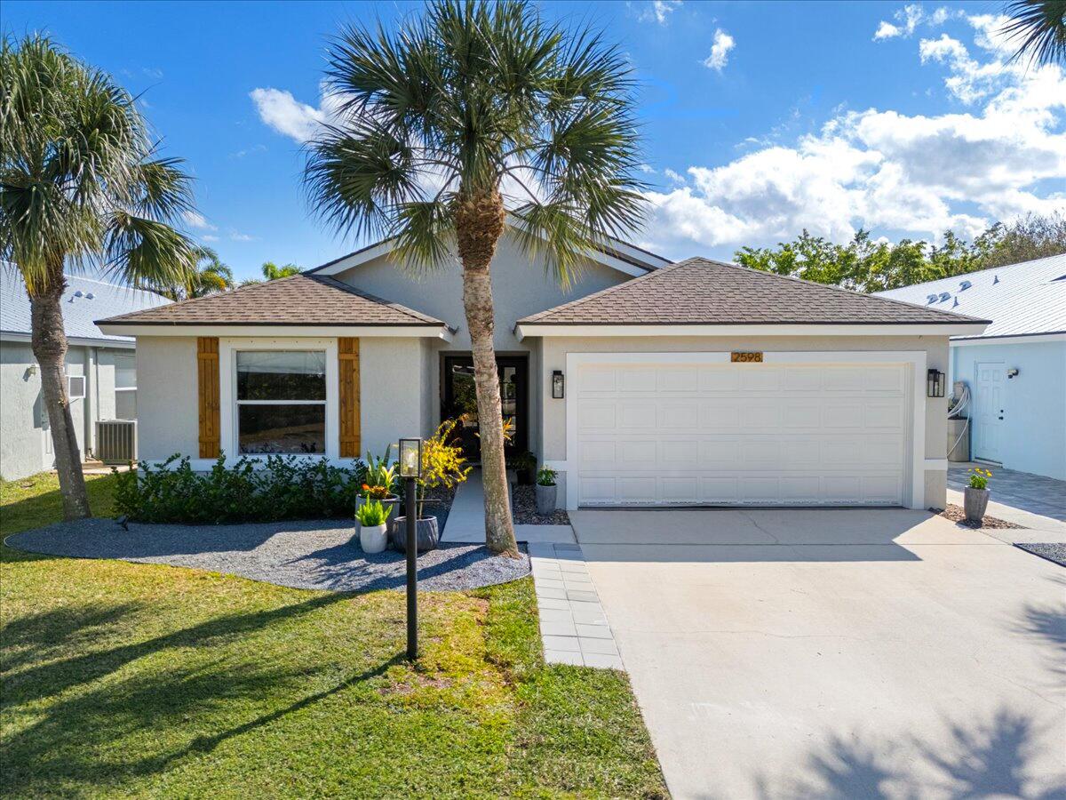 2598 Southwest Impala Way Stuart, FL 34997 - Photo 37 of 60 Front of home