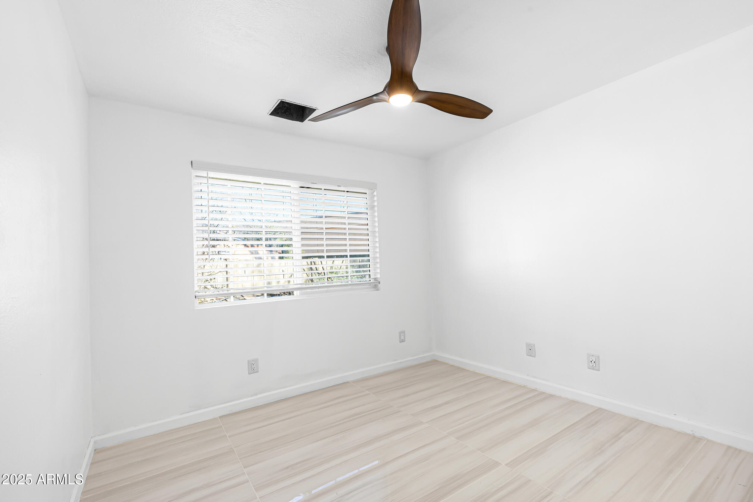 4401 West McRae Way Glendale, AZ 85308 - Photo 11 of 30 a view of empty room with wooden floor