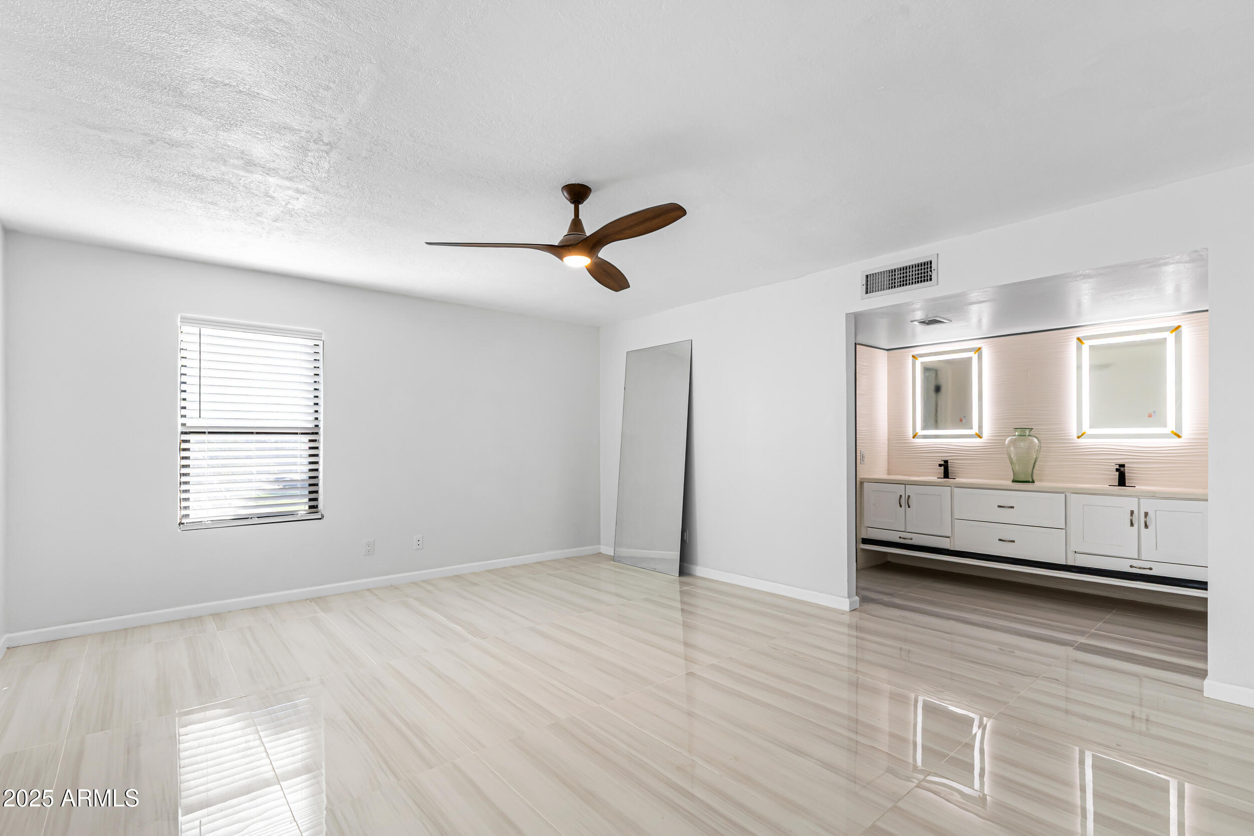 4401 West McRae Way Glendale, AZ 85308 - Photo 16 of 30 a view of a livingroom with furniture hardwood floor and a ceiling fan
