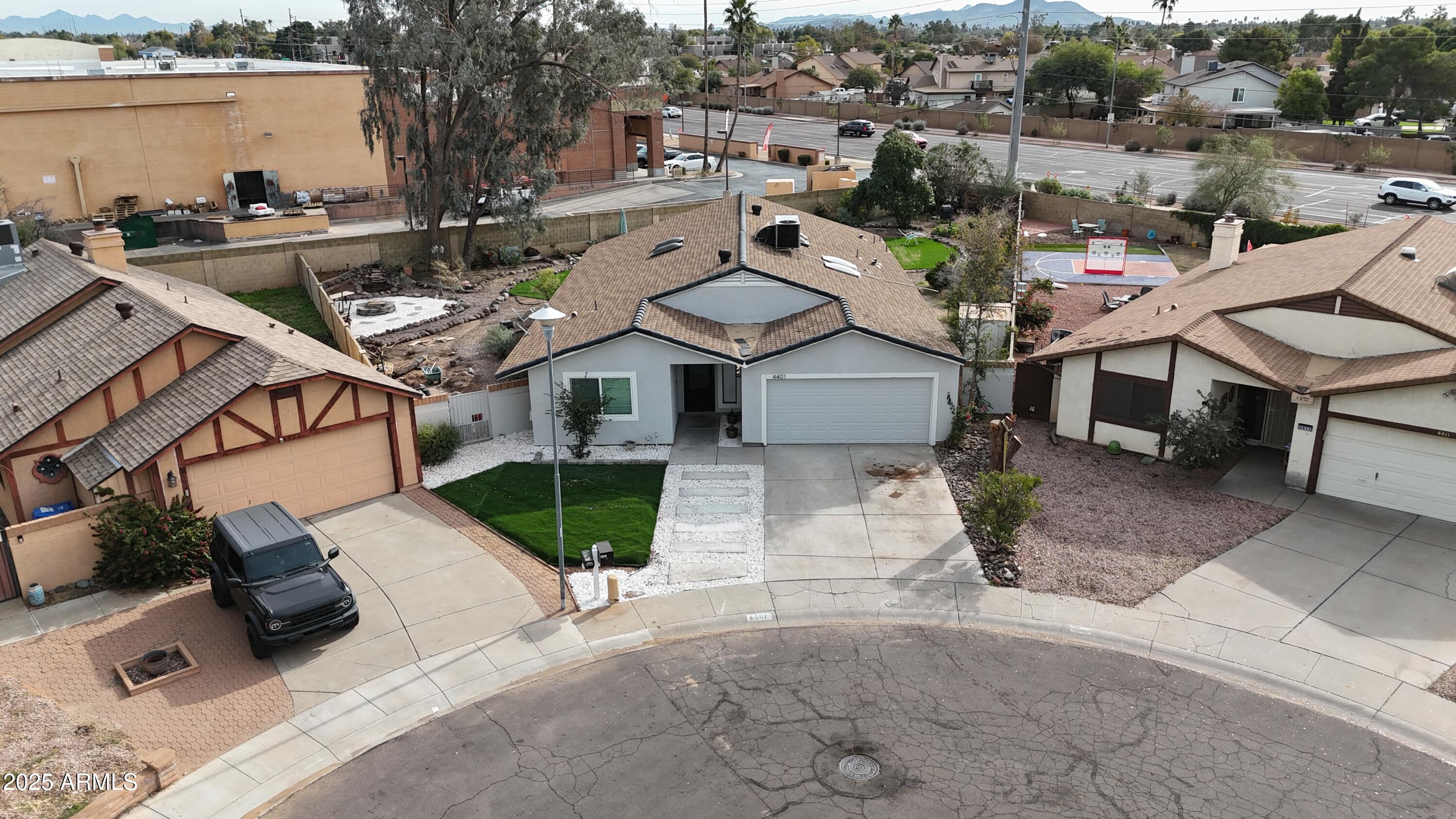 4401 West McRae Way Glendale, AZ 85308 - Photo 22 of 30 an aerial view of a house with garden space and street view