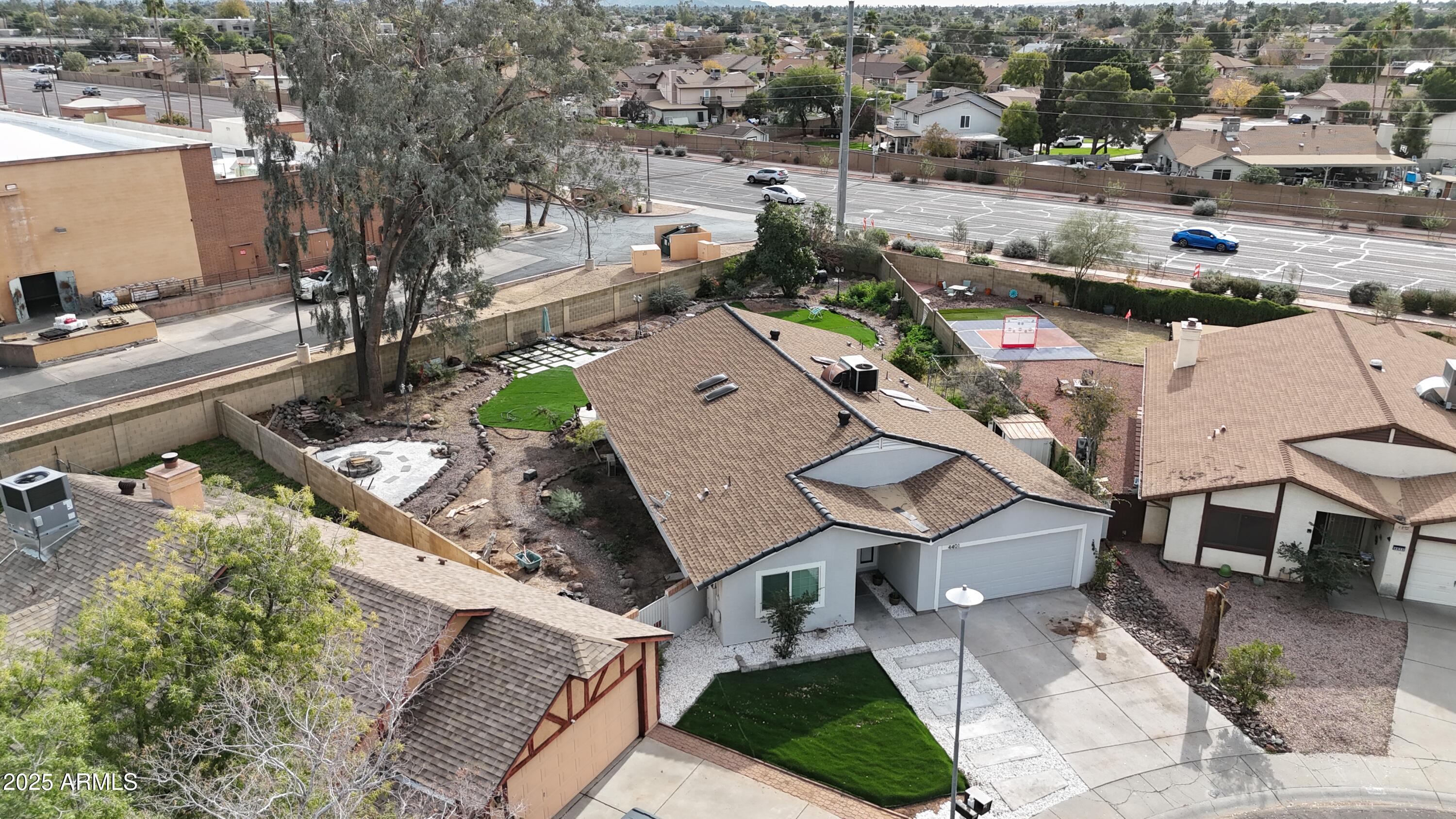 4401 West McRae Way Glendale, AZ 85308 - Photo 24 of 30 an aerial view of a house with a yard and lake view