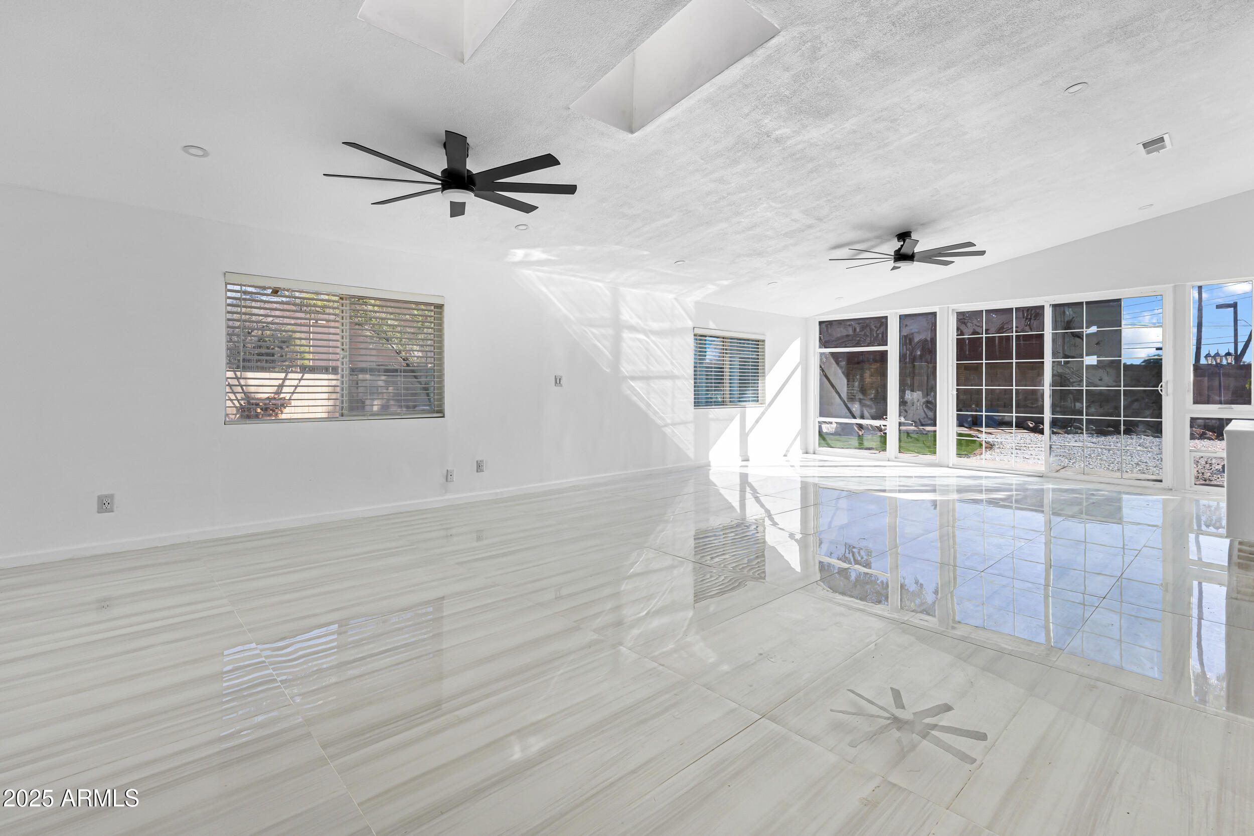 4401 West McRae Way Glendale, AZ 85308 - Photo 7 of 30 en empty room with windows