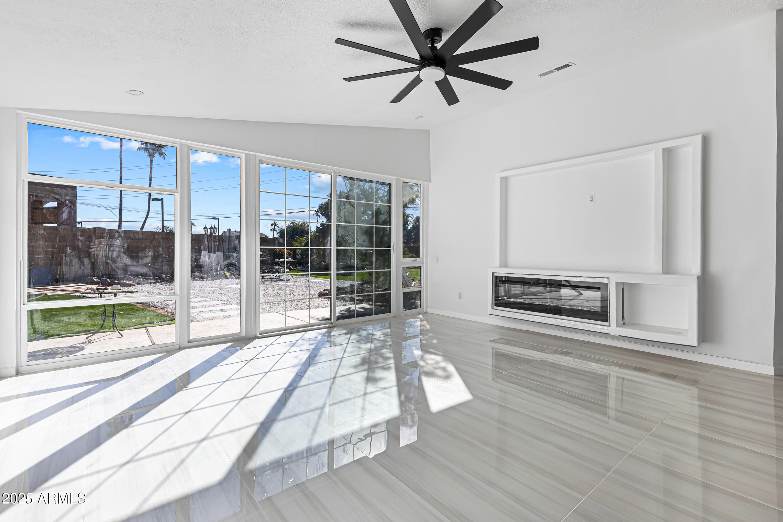 4401 West McRae Way Glendale, AZ 85308 - Photo 8 of 30 a living room with a floor to ceiling window and wooden floor