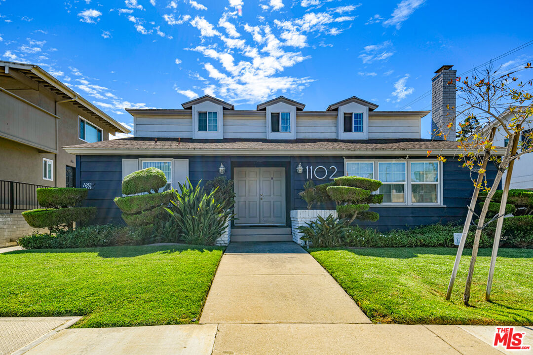 1102 Barbara Street Redondo Beach, CA 90277 - Photo 2 of 13 a front view of a house with garden